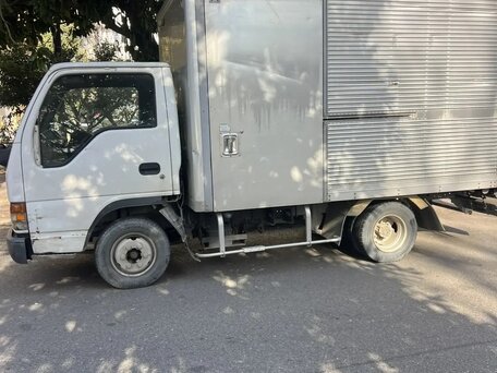 1999 Isuzu Elf (N-series), белый, 950000 рублей, вид 1