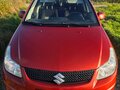 2010 Suzuki SX4 I (Classic) Рестайлинг, оранжевый, 645000 рублей - вид 2