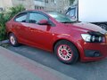 2012 Chevrolet Aveo II, красный, 650000 рублей - вид 9