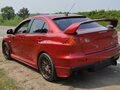 2008 Mitsubishi Lancer Evolution X, красный, 5250000 рублей - вид 2