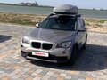 2013 BMW X1 18i I (E84) Рестайлинг, бежевый, 1300000 рублей - вид 1