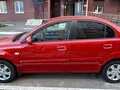 2011 Kia Rio II Рестайлинг, красный - вид 2