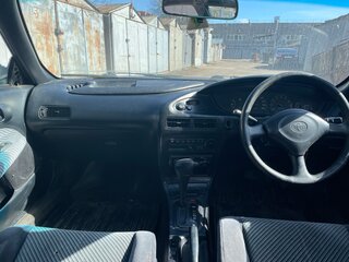 1993 Toyota Sprinter Marino, зелёный, 155000 рублей, вид 5