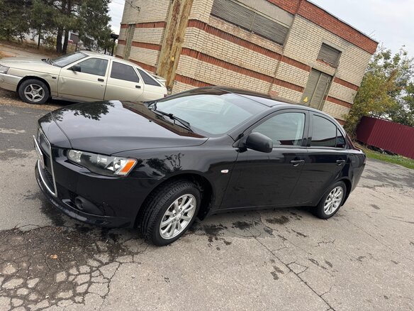 2012 Mitsubishi Lancer X Рестайлинг, чёрный, 830000 рублей - вид 2