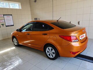 2014 Hyundai Solaris I Рестайлинг, оранжевый, 550000 рублей, вид 4