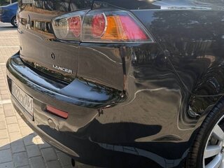 2010 Mitsubishi Lancer X, чёрный, 645000 рублей, вид 2