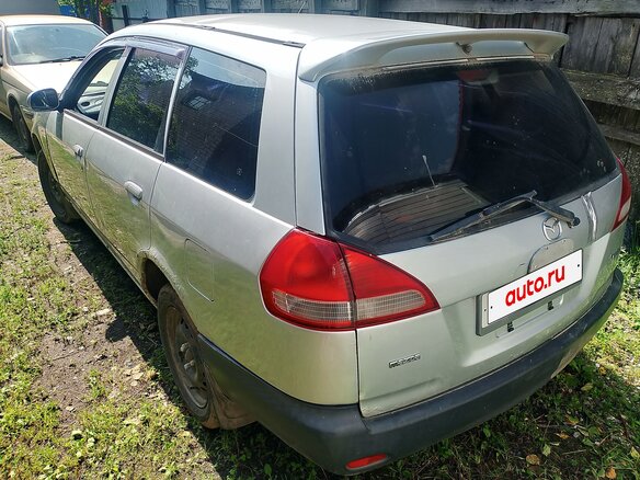 2000 Mazda Familia Y11, серебристый - вид 1