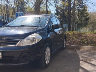 2010 Nissan Tiida I Рестайлинг, чёрный, 730000 рублей, вид 1