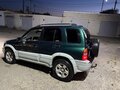 1999 Suzuki Grand Vitara I, зелёный - вид 3