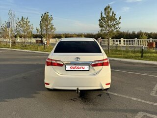 2014 Toyota Corolla XI (E160, E170, E180), белый, 1175000 рублей, вид 4