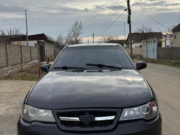 2012 Daewoo Nexia I Рестайлинг, чёрный, 150000 рублей
