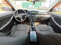 2005 Toyota Corolla IX (E120, E130) Рестайлинг, красный, 250000 рублей - вид 5