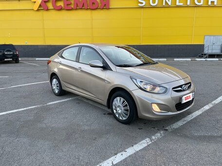 2011 Hyundai Solaris I, золотистый, 590000 рублей, вид 2