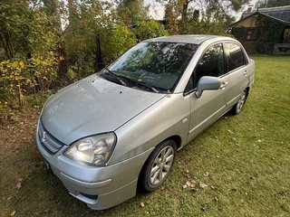 2004 Suzuki Liana I Рестайлинг, серебристый, 210000 рублей, вид 1