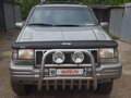 1997 Jeep Grand Cherokee I (ZJ) Рестайлинг, серебристый - вид 1
