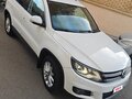 2011 Volkswagen Tiguan I Рестайлинг, белый - вид 1