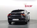 2024 Kia K5 III Рестайлинг, чёрный - вид 2
