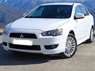 2007 Mitsubishi Lancer X, белый, 599000 рублей, вид 1