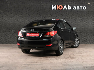 2011 Hyundai Solaris I, чёрный, 675000 рублей, вид 4