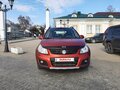 2011 Suzuki SX4 I (Classic) Рестайлинг, оранжевый - вид 1