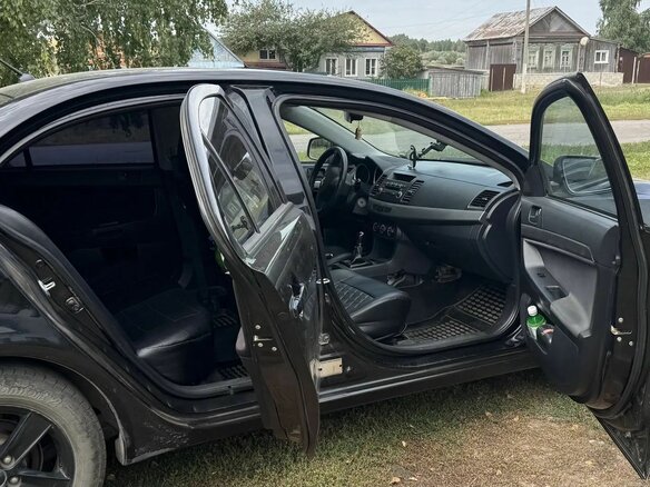 2010 Mitsubishi Lancer X, чёрный, 550000 рублей - вид 10