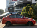 2010 Kia Rio II Рестайлинг, красный - вид 2