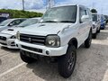 2013 Suzuki Jimny Kei car III Рестайлинг 2, белый - вид 1