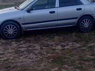 2003 Mitsubishi Carisma I Рестайлинг, серебристый, 155000 рублей, вид 2