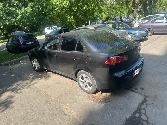 2008 Mitsubishi Lancer X, чёрный, 800000 рублей - вид 1