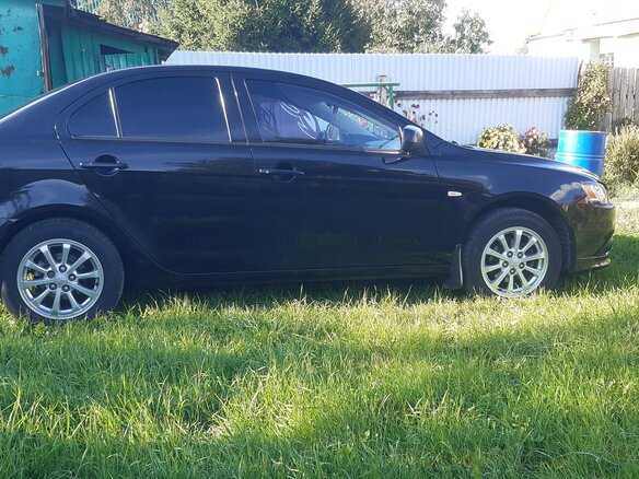 2012 Mitsubishi Lancer X Рестайлинг, чёрный, 1050000 рублей - вид 11