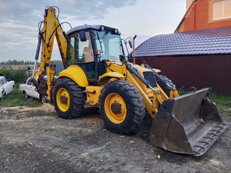 2005 New Holland B115B, жёлтый, 3150000 рублей, вид 1