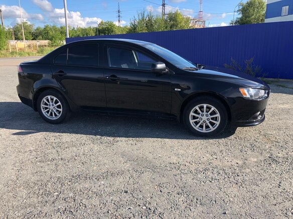 2014 Mitsubishi Lancer X Рестайлинг, чёрный, 980000 рублей - вид 4