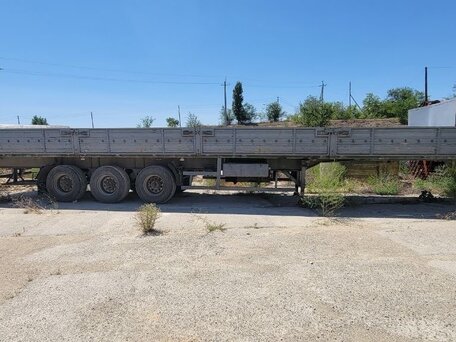 2009 МАЗ Полуприцеп бортовой, зелёный, 650000 рублей, вид 1