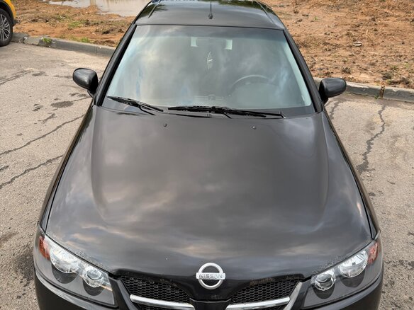 2004 Nissan Almera II (N16) Рестайлинг, чёрный - вид 1