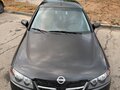 2004 Nissan Almera II (N16) Рестайлинг, чёрный - вид 1