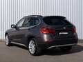 2011 BMW X1 18i I (E84), коричневый - вид 1