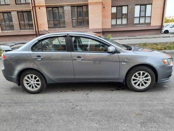 2012 Mitsubishi Lancer X Рестайлинг, серый - вид 1