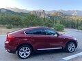 2010 BMW X6 50i 6-speed I (E71), красный