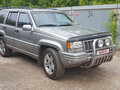 1997 Jeep Grand Cherokee I (ZJ) Рестайлинг, серебристый - вид 3