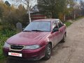 2011 Daewoo Nexia I Рестайлинг, пурпурный, 50000 рублей