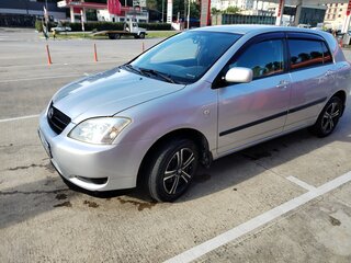 2004 Toyota Corolla IX (E120, E130), серебристый, 650000 рублей, вид 2