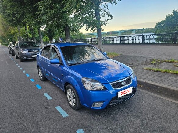 2010 Kia Rio II Рестайлинг, синий - вид 1