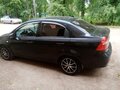 2011 Chevrolet Aveo I Рестайлинг, чёрный, 520000 рублей - вид 2