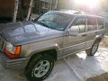 1998 Jeep Grand Cherokee I (ZJ) Рестайлинг, серебристый - вид 6