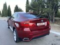 2010 BMW X6 50i 6-speed I (E71), красный - вид 4