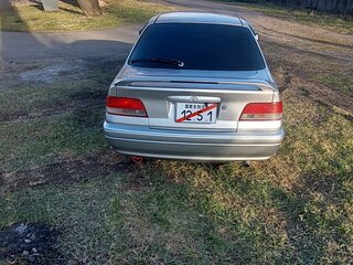 1997 Toyota Carina VII (T210), серебристый, 650000 рублей, вид 4