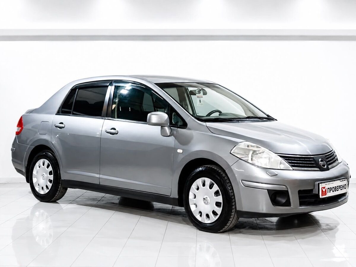 Открыть фотографии: Nissan Tiida I