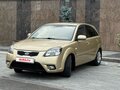 2011 Kia Rio II Рестайлинг, бежевый - вид 9