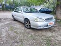 1999 Kia Clarus II, серый, 97000 рублей - вид 2