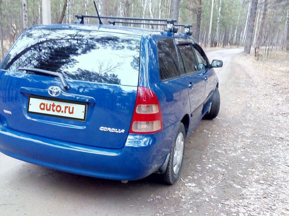 2004 Toyota Corolla IX (E120, E130), синий - вид 3